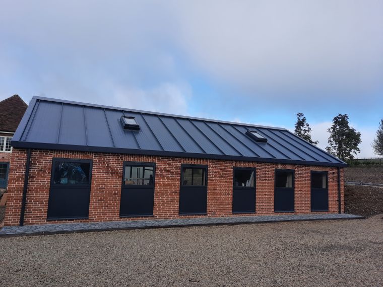 Custom built home gym building with steel roof